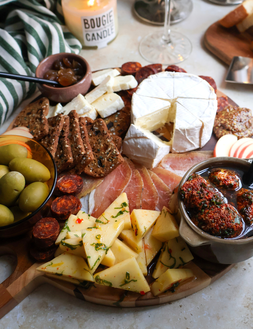 Charcuterie board with marinated mozzarella & spicy labneh