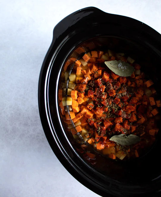 Vegan vegetable and bean stew with a garnish of fresh lemony herbs